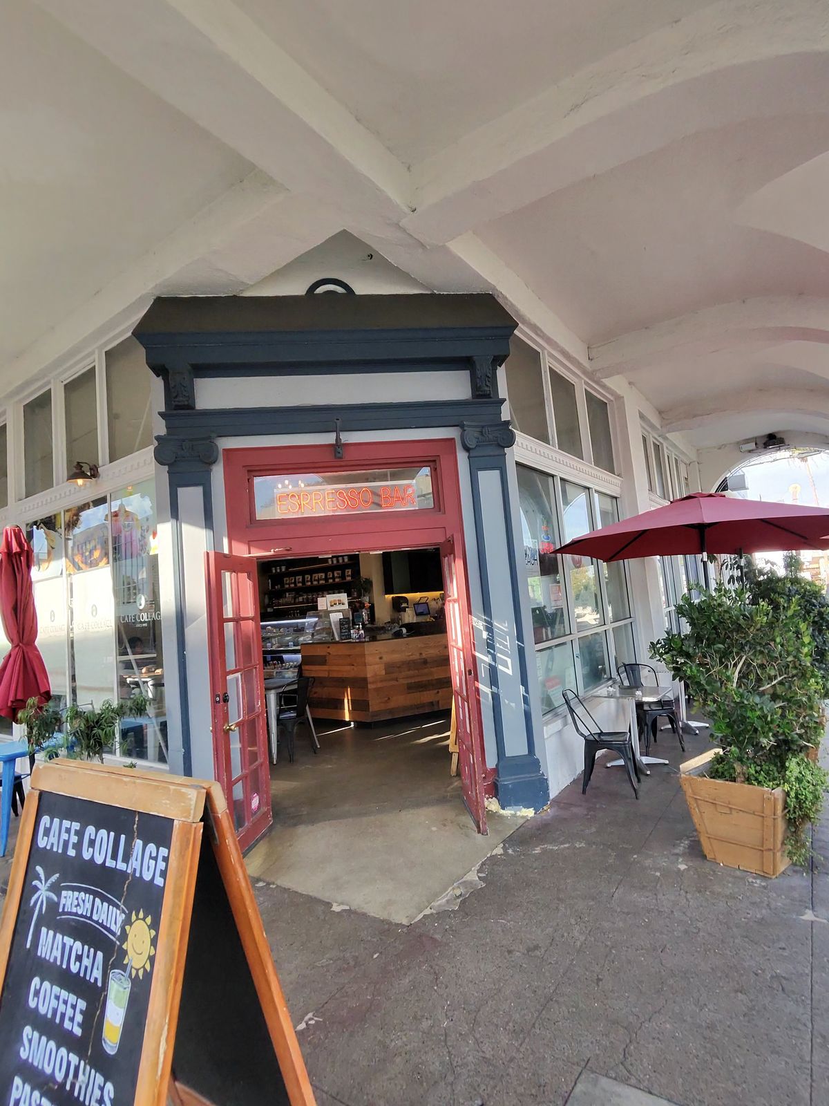 The entrance to a Venice cafe with a chalkboard sign out the front
