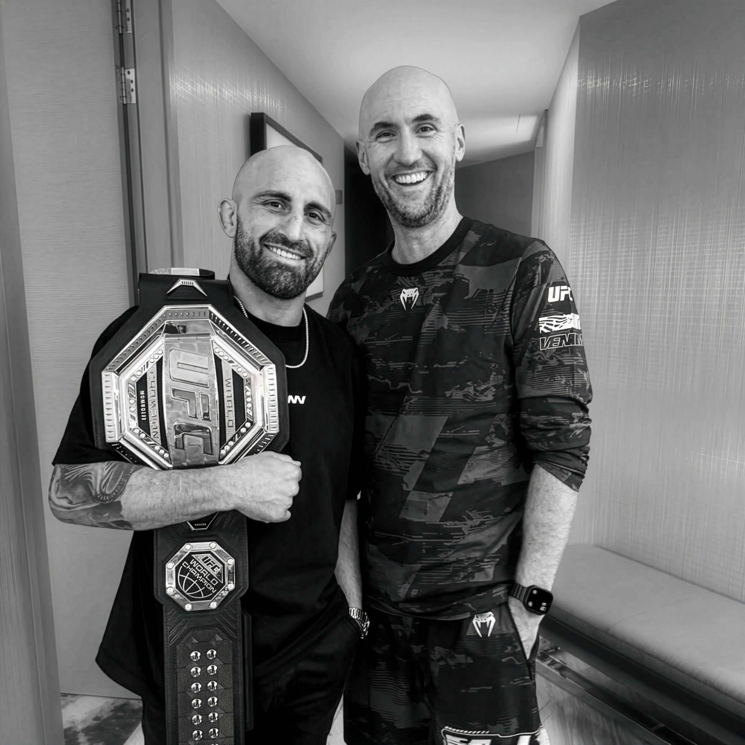 Mick Baines with Alexander Volkanovski and the UFC belt