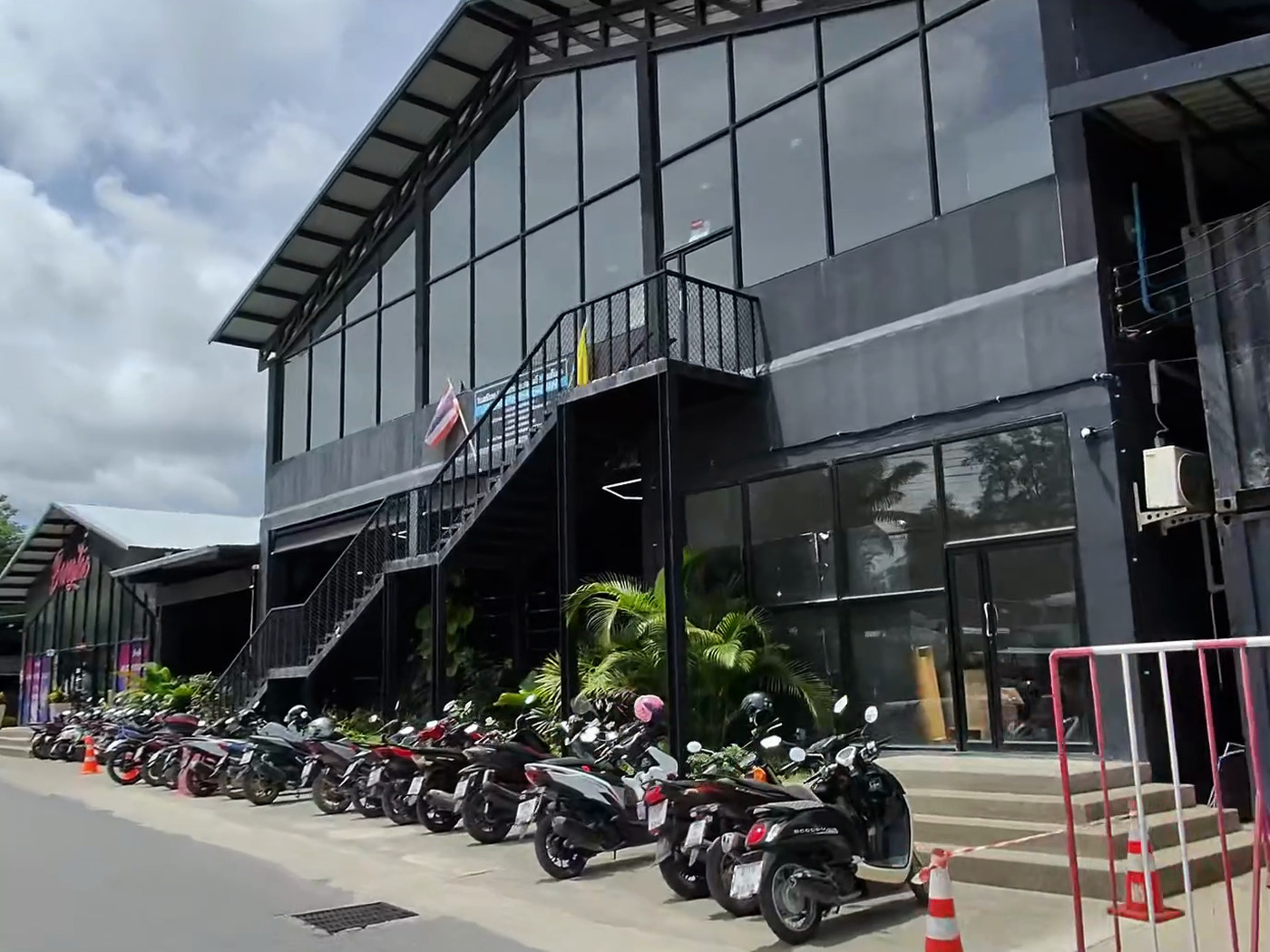 The training facility at Bang Tao with scooters parked out the front